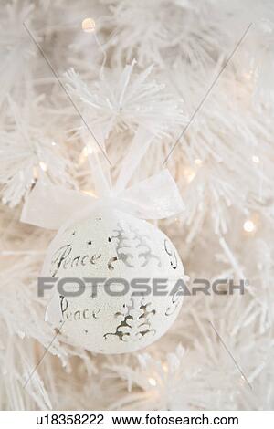 Stock Image - Close up of white Christmas ornament . Fotosearch