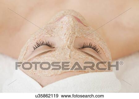 Close up of woman's face with beauty mask applied, Studio shot View Large Photo Image Stock Photo - Close up of woman's face with beauty mask applied, Studio shot. Fotosearch