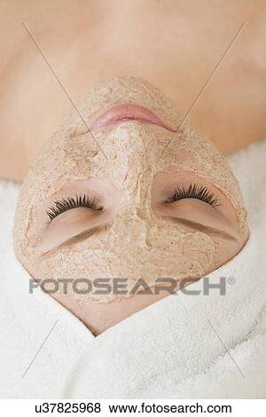 Close up of woman's face with beauty mask applied, Studio shot View Large Photo Image Stock Photo - Close up of woman's face with beauty mask applied, Studio shot. Fotosearch