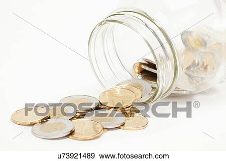 Coins spilling from jar View Large Photo Image Stock Photo - Coins spilling from jar. Fotosearch