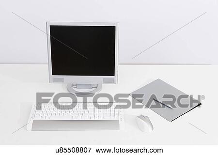 Computer and file on office desk, elevated view View Large Photo Image Stock Photo - Computer and file on office desk, elevated view. Fotosearch
