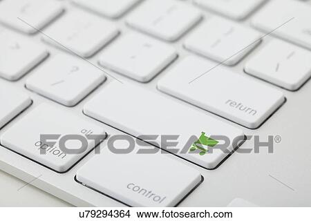 Computer keyboard with shopping cart icon on key View Large Photo Image Picture - Computer keyboard with shopping cart icon on key. Fotosearch