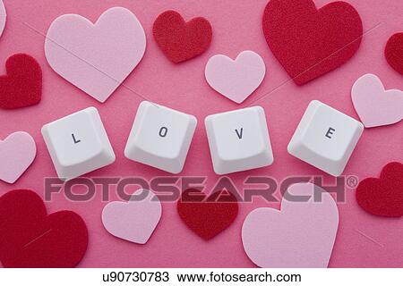 Computer keys arranged in word "love" and pink and red hearts View Large Photo Image Stock Image - Computer keys arranged in word "love" and pink and red hearts. Fotosearch