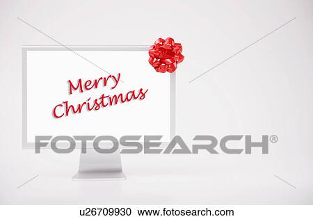 Computer monitor displaying merry Christmas phrase View Large Photo Image Stock Image - Computer monitor displaying merry Christmas phrase. Fotosearch