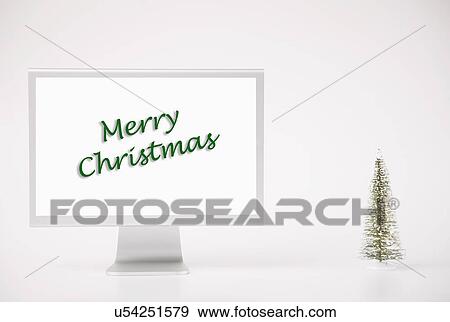 Computer monitor displaying merry Christmas phrase View Large Photo Image Stock Photo - Computer monitor displaying merry Christmas phrase. Fotosearch