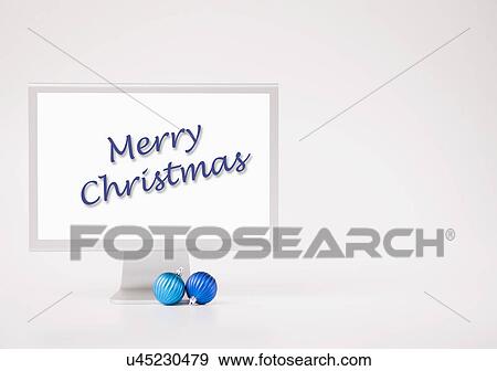 Computer monitor with Christmas baubles View Large Photo Image Stock Photo - Computer monitor with Christmas baubles. Fotosearch