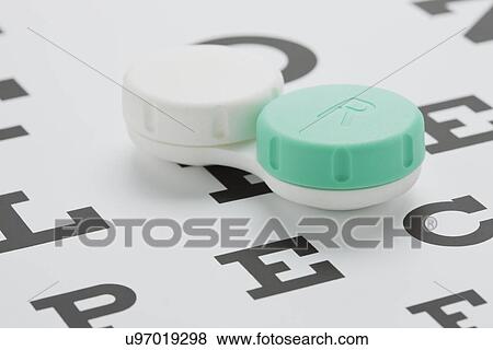 Contact lenses in case on eye chart, studio shot View Large Photo Image Stock Photo - Contact lenses in case on eye chart, studio shot. Fotosearch