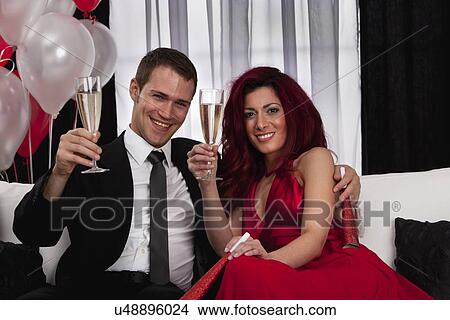 Couple celebrating with champagne View Large Photo Image Picture - Couple celebrating with champagne. Fotosearch