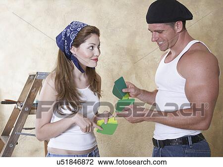 Couple looking at color samples View Large Photo Image Stock Image - Couple looking at color samples. Fotosearch