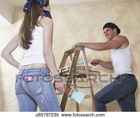 Couple painting room View Large Photo Image Stock Photography - Couple painting room. Fotosearch