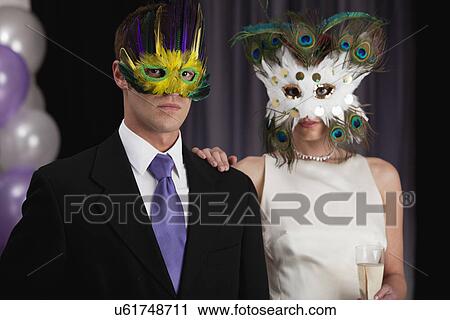 Couple posing in carnival masks View Large Photo Image Stock Image - Couple posing in carnival masks. Fotosearch