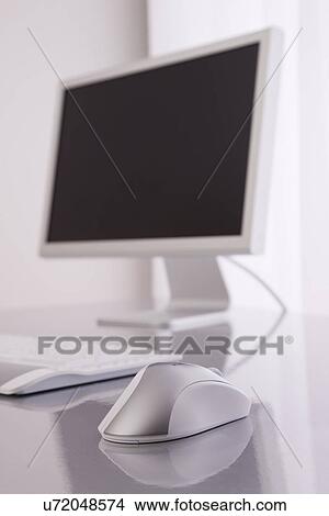 Picture - Desktop PC on desk. Fotosearch