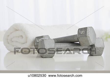 Dumbbells and towel View Large Photo Image Stock Image - Dumbbells and towel. Fotosearch