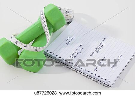 Dumbbells, measuring tape and notebook View Large Photo Image Stock Photo - Dumbbells, measuring tape and notebook. Fotosearch