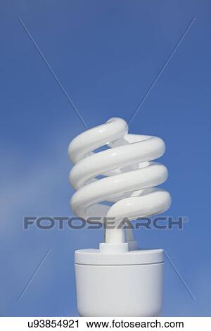 Energy efficient light bulb on blue background View Large Photo Image Stock Image - Energy efficient light bulb on blue background. Fotosearch