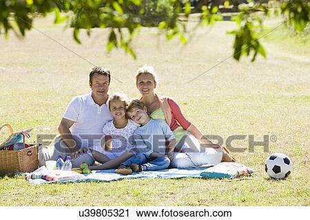 Family having picnic in park View Large Photo Image Stock Image - Family having picnic in park. Fotosearch