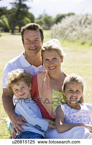 Family sitting in park View Large Photo Image Stock Photography - Family sitting in park. Fotosearch