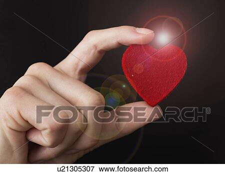 Felt heart in teenager's (14-15) hands View Large Photo Image Stock Photo - Felt heart in teenager's (14-15) hands. Fotosearch