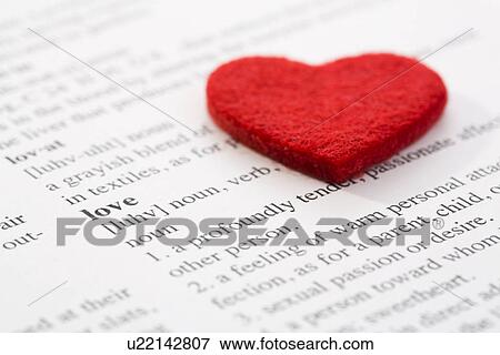 Stock Photo - Felt heart on dictionary. Fotosearch