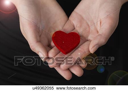 Felt heart on teenager's (14-15) hands View Large Photo Image Stock Photography - Felt heart on teenager's (14-15) hands. Fotosearch