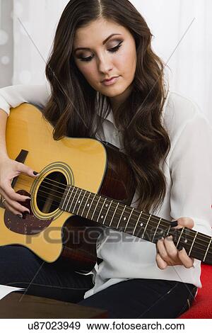 Female composer playing guitar View Large Photo Image Stock Photo - Female composer playing guitar. Fotosearch