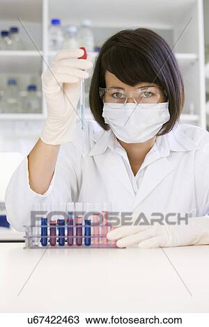 Female scientist doing research in laboratory, portrait View Large Photo Image Stock Image - Female scientist doing research in laboratory, portrait. Fotosearch