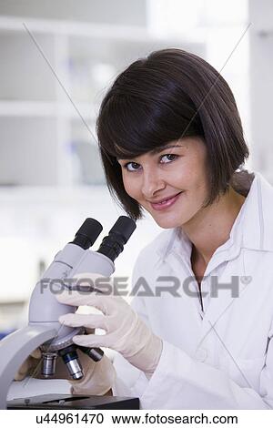 Female scientist using microscope in laboratory, portrait View Large Photo Image Stock Image - Female scientist using microscope in laboratory, portrait. Fotosearch
