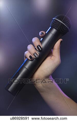 Female singer on stage View Large Photo Image Stock Image - Female singer on stage. Fotosearch