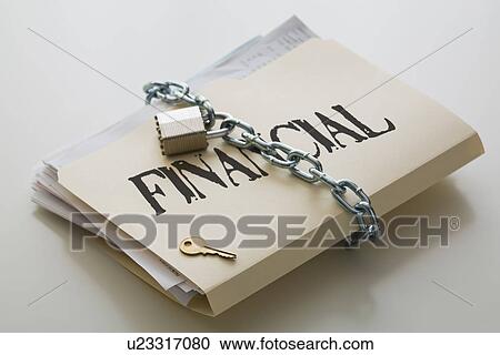 Stock Image - Financial folder with files closed with chain and padlock. Fotosearch