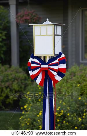 Fourth of July red white and blue rosette on lantern View Large Photo Image Stock Image - Fourth of July red white and blue rosette on lantern. Fotosearch