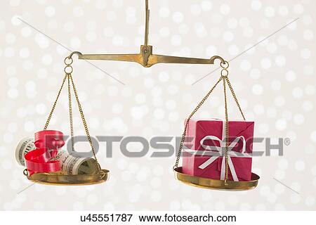 Gift and banknotes on scale of justice View Large Photo Image Stock Photo - Gift and banknotes on scale of justice. Fotosearch