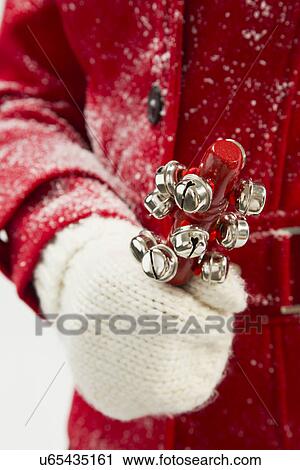 Girl (12-13) holding jingle bells View Large Photo Image Stock Image - Girl (12-13) holding jingle bells. Fotosearch
