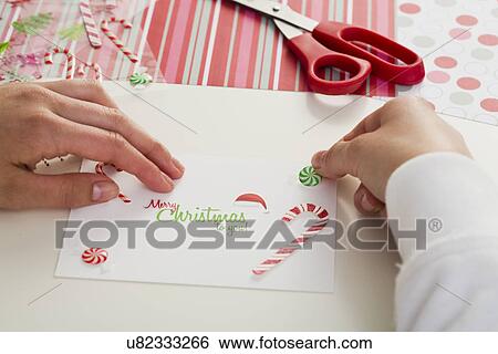 Girl (12-13) making Christmas card View Large Photo Image Stock Photograph - Girl (12-13) making Christmas card. Fotosearch