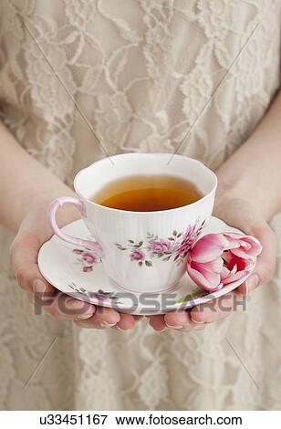 Girl (2-13) holding teacup View Large Photo Image Stock Photo - Girl (2-13) holding teacup. Fotosearch