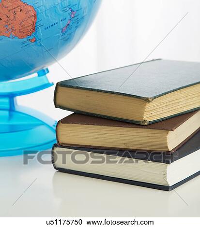 Globe and stack of books View Large Photo Image Stock Image - Globe and stack of books. Fotosearch