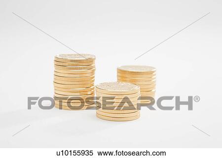Stock Photography - Gold coins in stack, studio shot. Fotosearch
