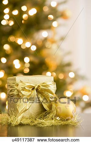 Golden Christmas gift and decoration View Large Photo Image Stock Photo - Golden Christmas gift and decoration. Fotosearch
