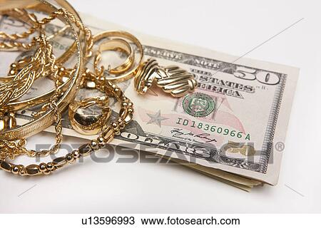 Golden jewelry and fifty dollar banknotes View Large Photo Image Stock Image - Golden jewelry and fifty dollar banknotes. Fotosearch