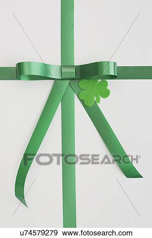 Green bow and shamrock on white View Large Photo Image Stock Photo - Green bow and shamrock on white. Fotosearch