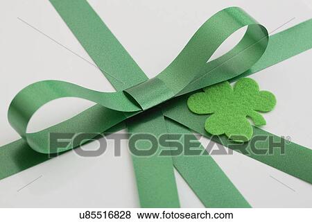 Stock Photo - Green bow and shamrock on white. Fotosearch