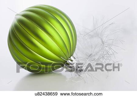 Green Christmas bauble, studio shot View Large Photo Image Stock Photo - Green Christmas bauble, studio shot. Fotosearch