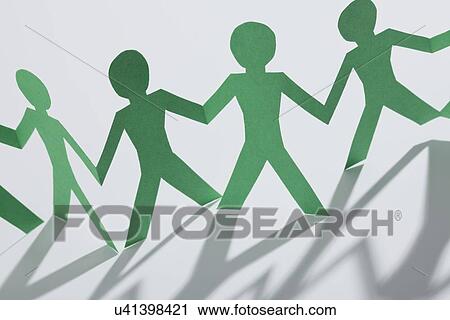 Stock Image - Green paper figurines, studio shot. Fotosearch