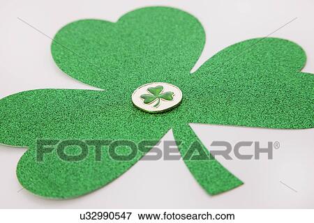Stock Photo - Green shamrock on white background. Fotosearch