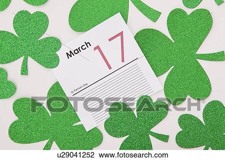Green shamrocks and 17th March calendar card View Large Photo Image Stock Image - Green shamrocks and 17th March calendar card. Fotosearch