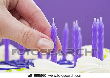 Han putting candles on cake, close-up View Large Photo Image Stock Image - Han putting candles on cake, close-up. Fotosearch