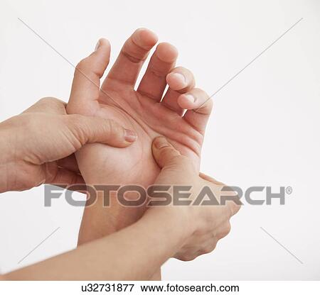 Stock Photo - Hand massage, close-up. Fotosearch