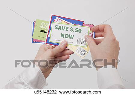 Hands holding coupons View Large Photo Image Stock Image - Hands holding coupons. Fotosearch
