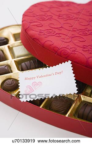 Heart shape chocolate box with Valentine's Day greeting card View Large Photo Image Stock Photo - Heart shape chocolate box with Valentine's Day greeting card. Fotosearch