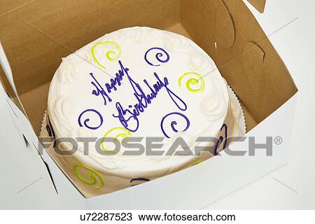 Stock Image - High angle view of birthday cake in box. Fotosearch