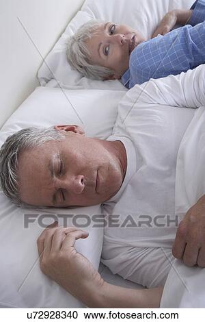 High angle view of mature couple in bed View Large Photo Image Stock Image - High angle view of mature couple in bed. Fotosearch